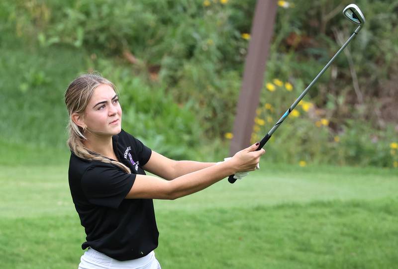 Hampshire’s Lorna Bachta wtaches her tee shot on the par three tenth hole Thursday, Sept. 28, 2023, during the Class 2A girls golf regional at Sycamore Golf Club in Sycamore.