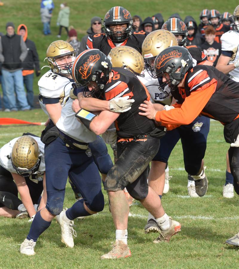 Milledgeville's Karter Livengood (48) fights his way into the end zone during 8-man playoff action against Polo on Saturday, Nov. 16, 2024 at Milledgeville.