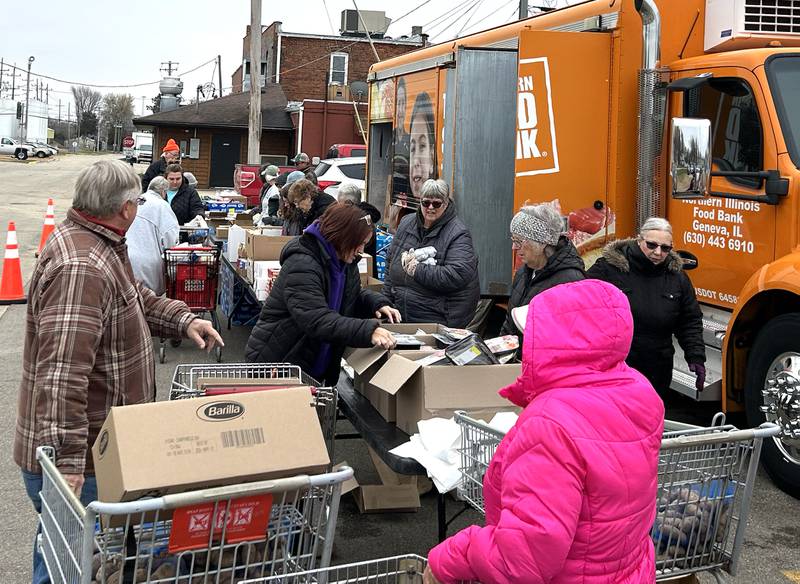Volunteers from the Polo Lifeline Food Pantry helped distribute food items on Wednesday, Nov. 19, 2025 from the Northern Illinois Food Bank's mobile food market truck. People waited in their vehicles and took turns filling shopping carts during the morning event in the parking area next to the pantry in Polo.