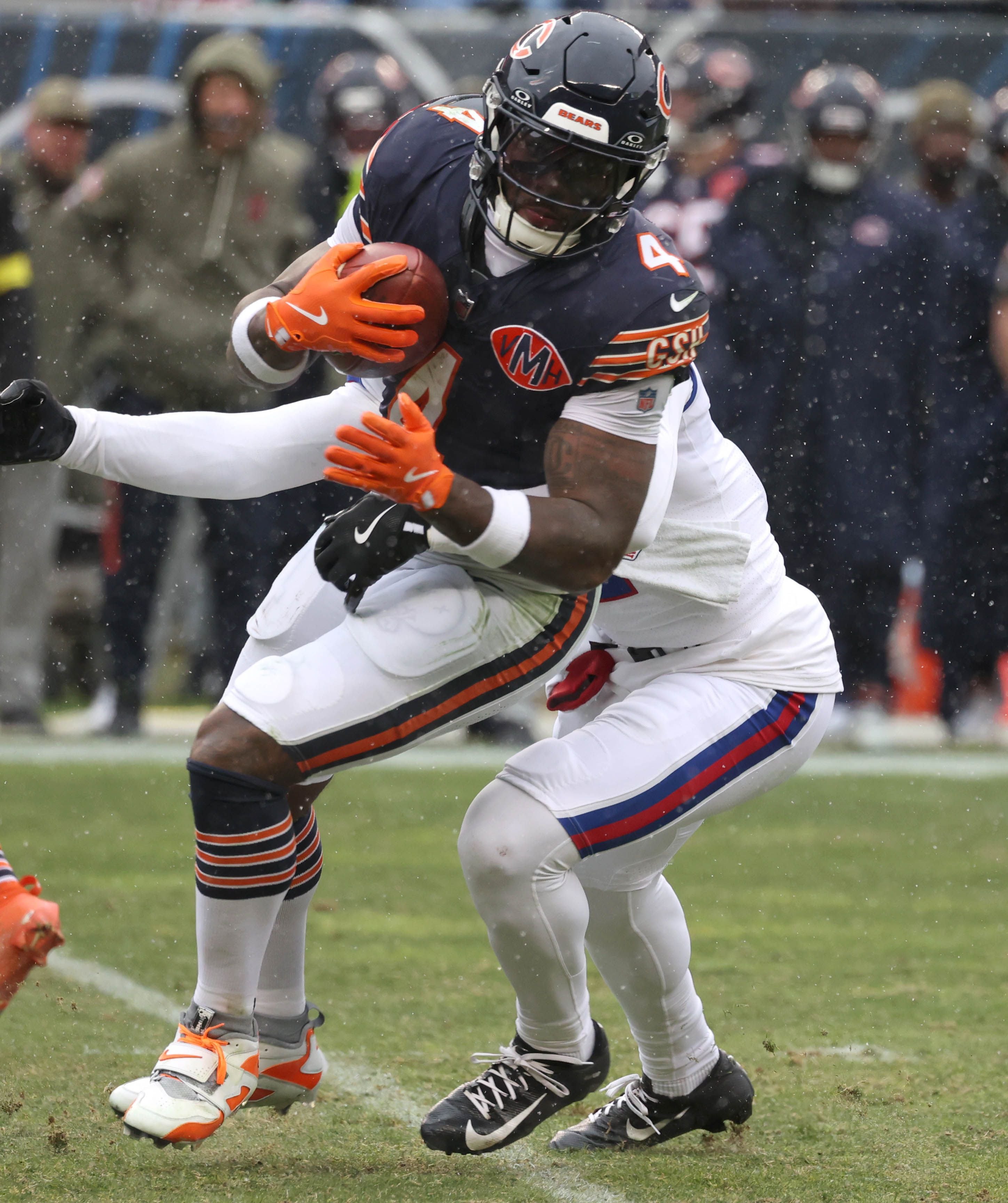 Chicago Bears running back D'Andre Swift tries to escape a New York Giants defender Sunday, Nov. 9, 2025, during their game at Soldier Field in Chicago.