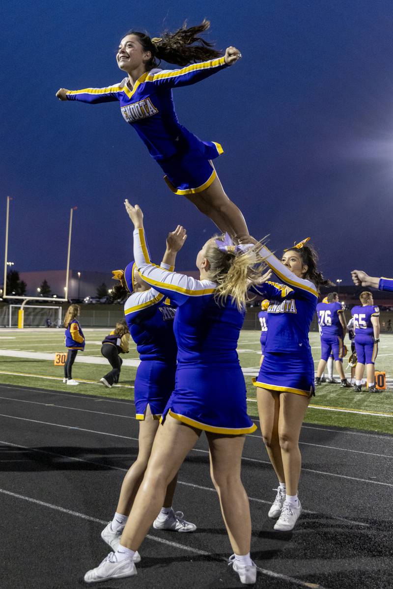 Mendota cheer leader Briza Cervantes stretches out a toss during the Mendota versus Sherrard game at Mendota High School on September 27, 2024.