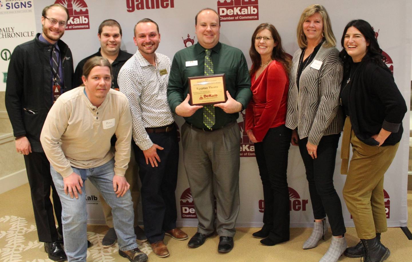 The Egyptian Theatre staff and board members shown receive the DeKalb Chamber of Commerce 2022 Nonprofit of the Year award.