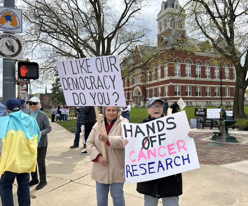 Sharon Lauer and Kathy Thomas were two of the approximately 250 people whgo attended a Hands Off rally on Saturday, April 19, 2025 around the historic Ogle County Courthouse in Oregon. Participants carried signs critical of  the Trump administration. Saturday's rally followed an April 5 rally held at the same location.