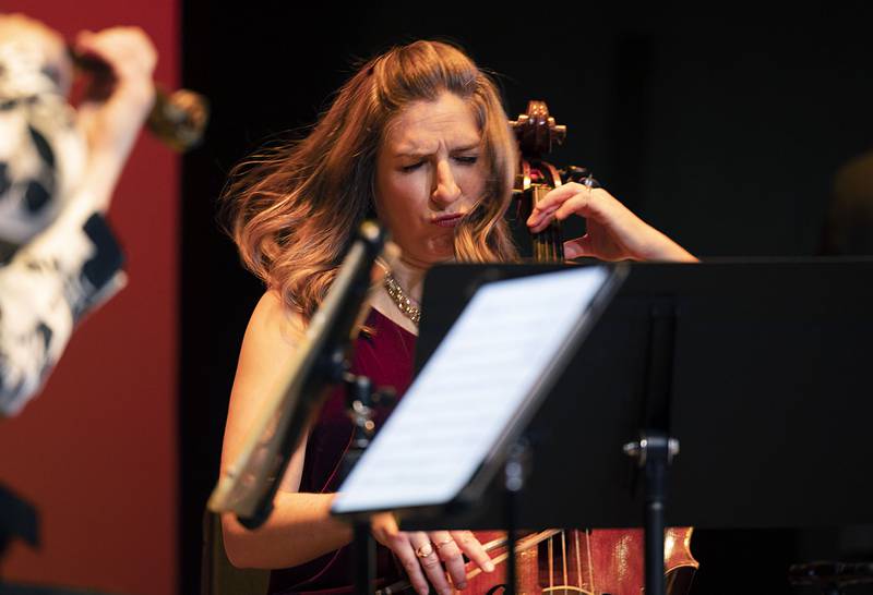 Feeling the power of the music, cellist Jean Hatmaker, performs for the crowd Wednesday, Jan. 11, 2023 at Dixon Stage Left.