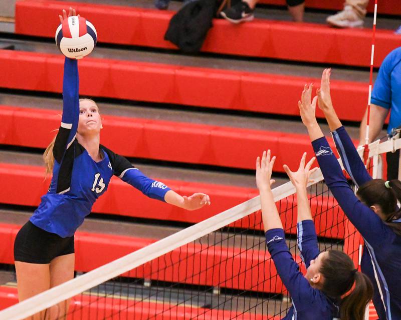 Geneva's Emma Peterson (15) spikes the ball past Nazareth Academy's defenders during the sectional title game on Thursday Nov. 6, 2025, held at Timothy Christian High School.