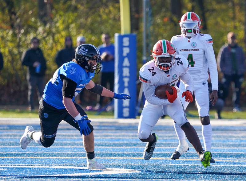 Morgan Park's Keshawn Lewis-Hunt (24) carries the ball against St. Francis during a class 5A state quarterfinal football game at St. Francis High School in Wheaton on Saturday, Nov 11, 2023.