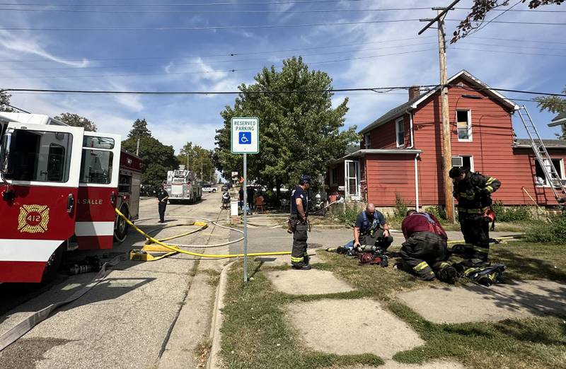 La Salle and Peru firefighters work the scene of a structure fire in the 300 block of Crosat Street on Thursday, Sept. 19, 2024 in La Salle. The fire happened shortly after 12:30p.m.