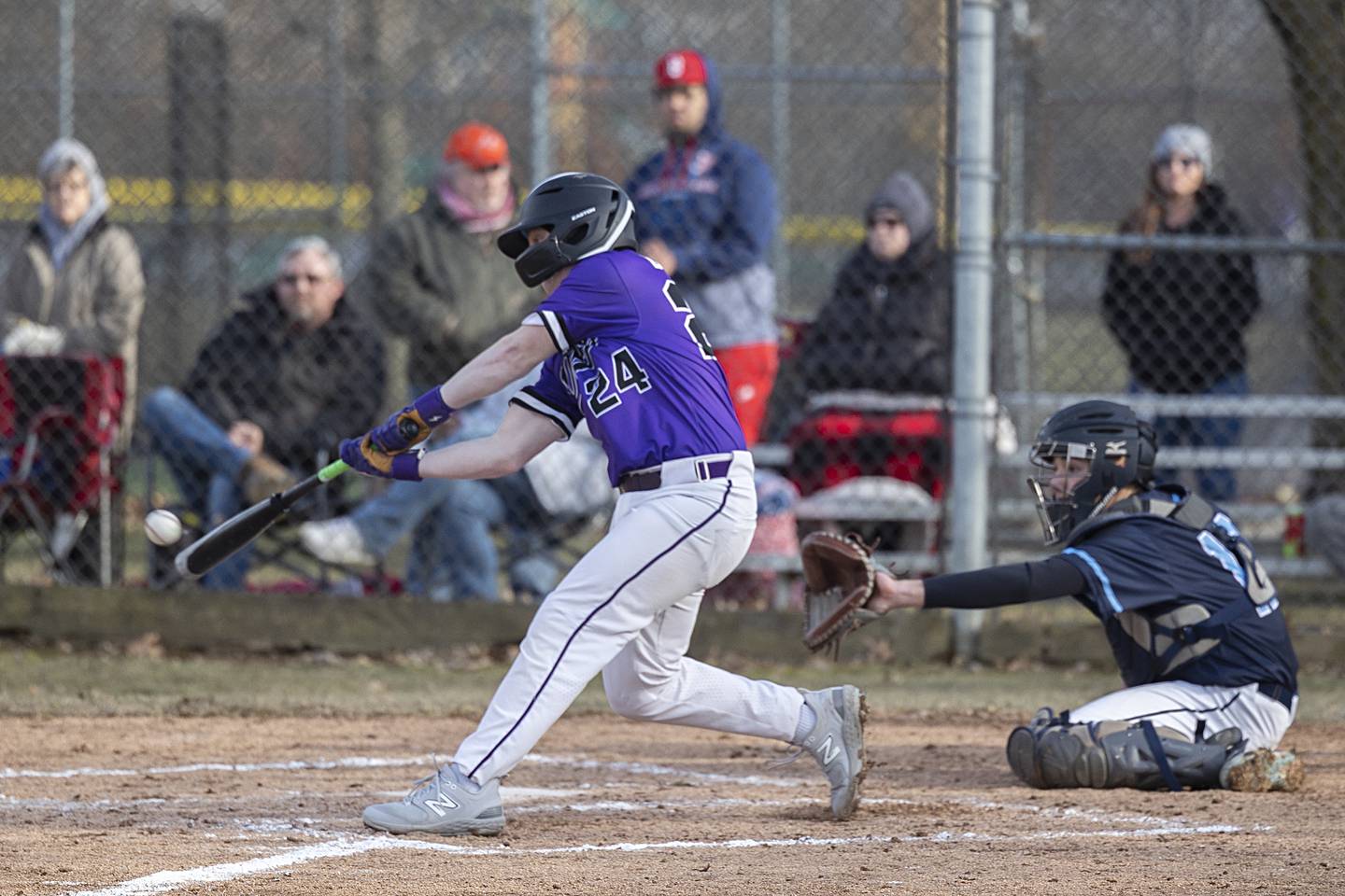 Dixon’s Kyan Adkins ropes a hit to right to drive in two Monday, March 20, 2023 against Rockford Guilford.