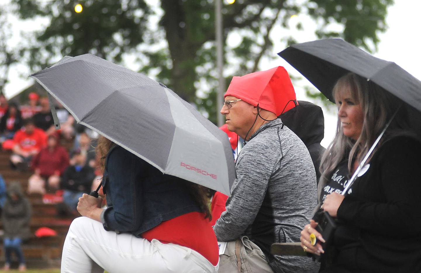 People try to keep dry as they listen to the views of Republican gubernatorial candidates during the Grand Old Party at the Farm Forum on Saturday, June 4, 2022, at Richardson Farm, 909 English Prairie Road, in Spring Grove. The all day event forum featured Republican candidates up and down the ticket on multiple stages.