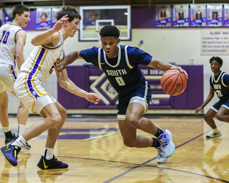 Downers Grove South's Jalen House (0) makes a move to the basket during basketball game between Downers Grove South at Downers Grove North. Dec 16, 2023.