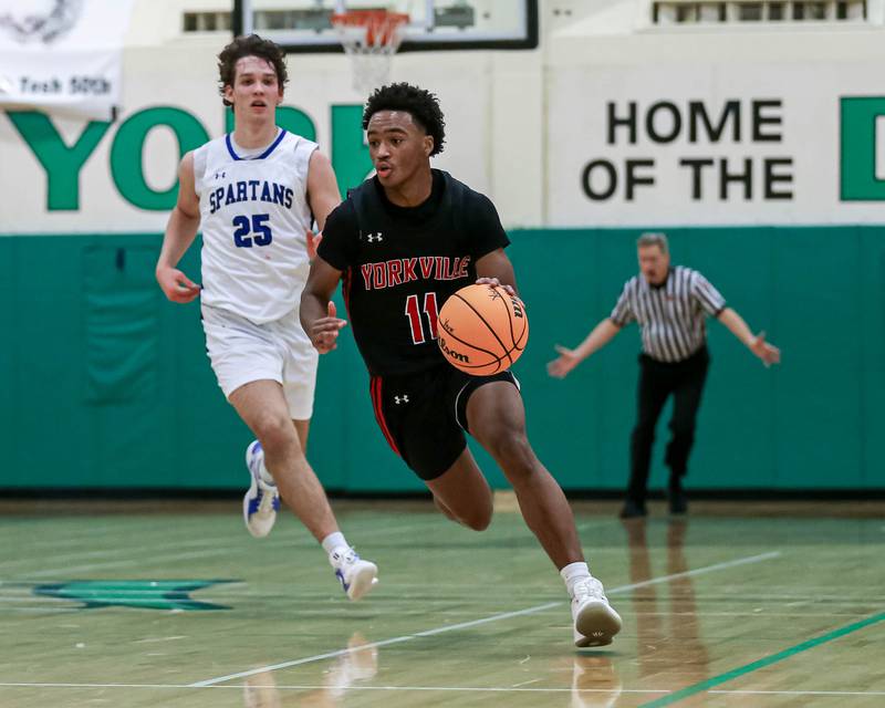 Yorkville's Christian Harrell (11) races down the court during their Jack Tosh Holiday Classic basketball tournament game between St Francis at Yorkville Thursday Dec 26, 2024 in Elmhurst.