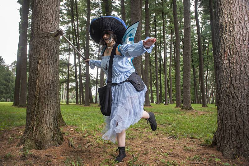 Gwen Moore, 27, of Dixon portrays “Serendipity” during a live action roleplaying session at Lowell Park. "Serendipity" is a corrupted mushroom fairy who possesses warlock properties and is one of the counselors to the king.