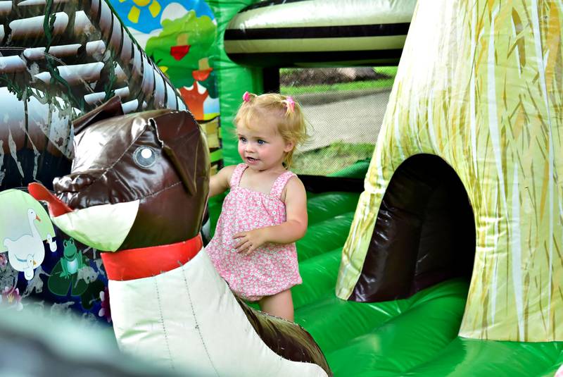 Audrey DeShane enjoys the bounce house Saturday, August 9, 2025 during the inaugural Make a Farmer festival in Prophetstown. The festival had a car/truck/tractor show, bounce houses, a bags tournament, food, music, raffles and more to make for a fun filled summer family event.