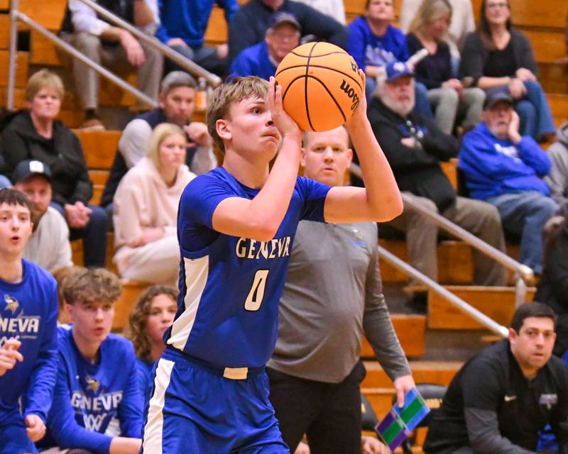 Geneva's Dane Turner (0) takes a shot while Geneva's head coach Brad Wendell looks on during the game on Tuesday Jan. 6, 2025, while traveling to take on Glenbard North.