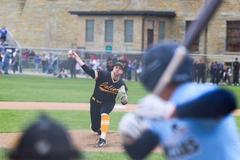 A Joliet Slammers pitcher delivers a pitch against the Gate Way Grizzlies during the Joliet Slammers preseason game at the Old Joliet Prison on Thursday, April 29, 2026 in Joliet.