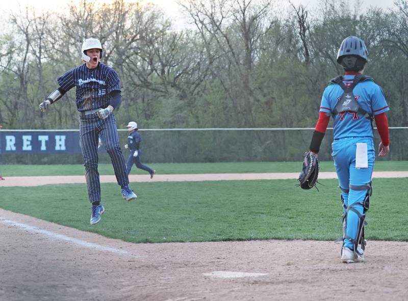 Nazareth's Cole Reifsteck (15) celebrates Jaden Fauske's grand slam home run as he approaches home plate during the varsity baseball game between Benet Academy and Nazareth Academy in La Grange Park on Monday, April 24, 2023.