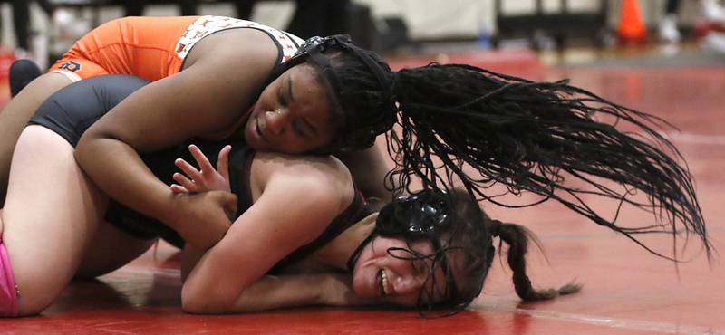 DeKalb’s Kayden Johnson tries to control Morris’ Nicolette Boleman in the 155-pound match of a nononference wrestling meet on Wednesday, Jan. 22, 2025, at Huntley High School.