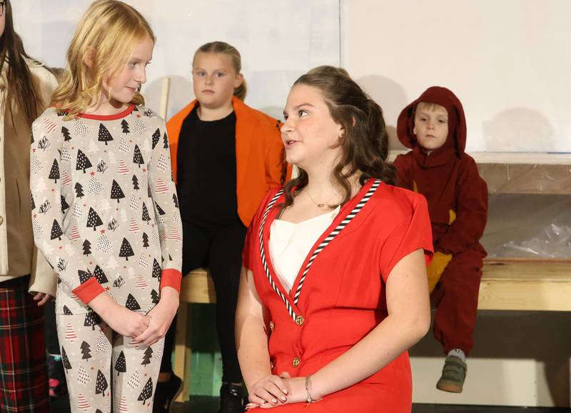Rose Tracey as Hannah Bloom, and Stella Funderberg as Mrs. Ethel act out a scene during a rehearsal of “The Magic of Christmas” the Children’s Christmas Musical on Tuesday, Nov. 11, 2025 at the Prairie Art’s Center in Princeton.