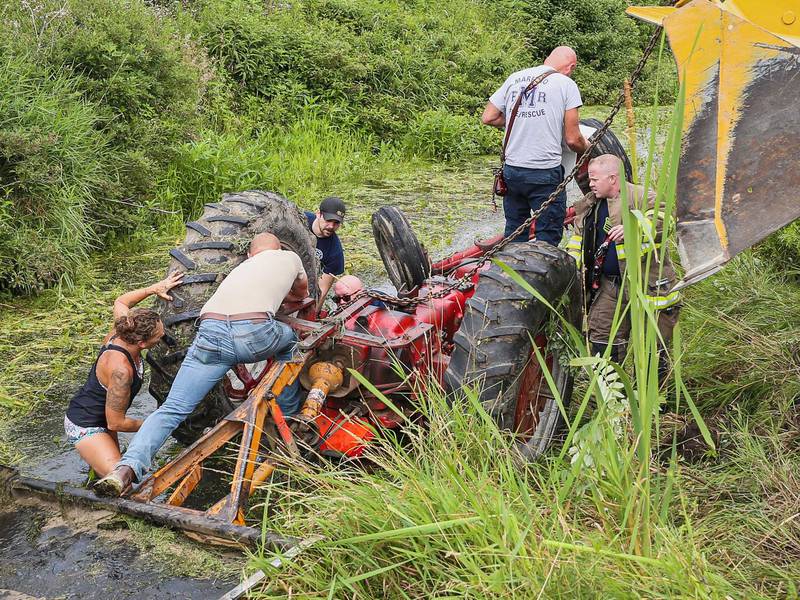 Harvard firefighters, along with Bob Dodson's family and neighbors, were able to free the man pinned under a tractor within 25 minutes after first-responders arrived on July 20, 2025.