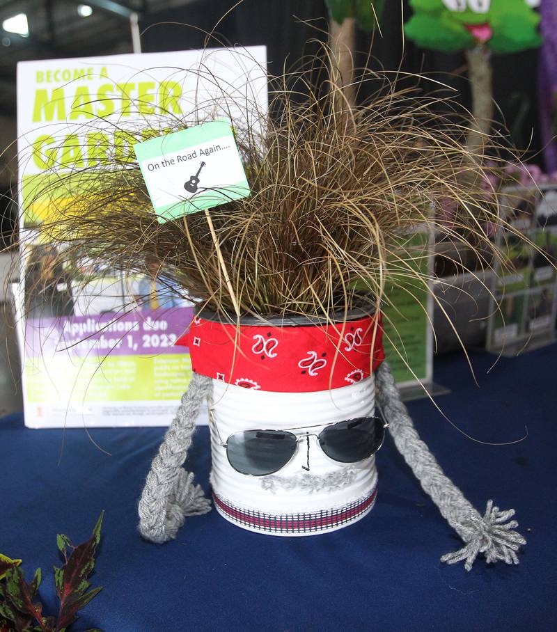 A container garden with ornamental grasses planted in an old soup can was named, "Willie Nelson," on display in the University of Illinois Extention Lake County booth in the Expo Hall before the start of the Lake County Fair on Tuesday, July 25th at the Lake County Fairgrounds in Grayslake. The fair runs from July 26th-30th.
Image by Candace H. Johnson for Shaw Local News Network