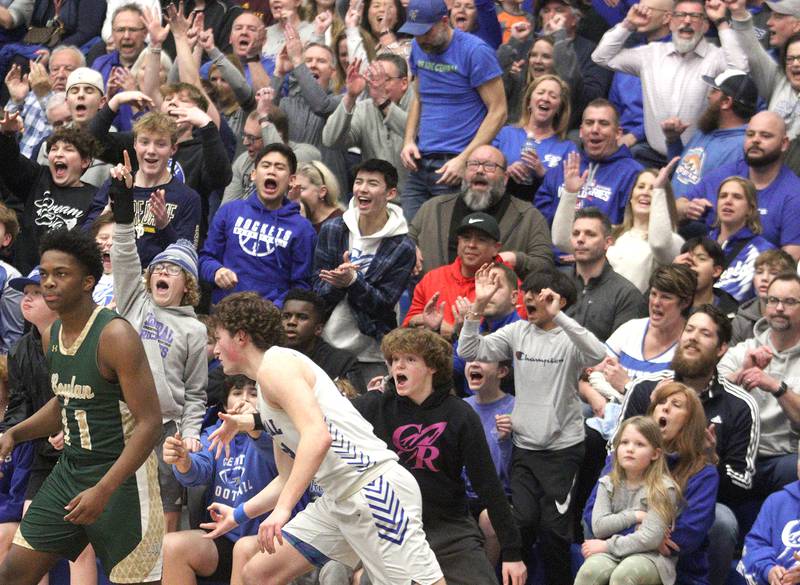Burlington Central’s fans roar after a Nicholas Gouriotis basket against Rockford Boylan in IHSA Class 3A Sectional action at Burlington Central High School Wednesday night.
