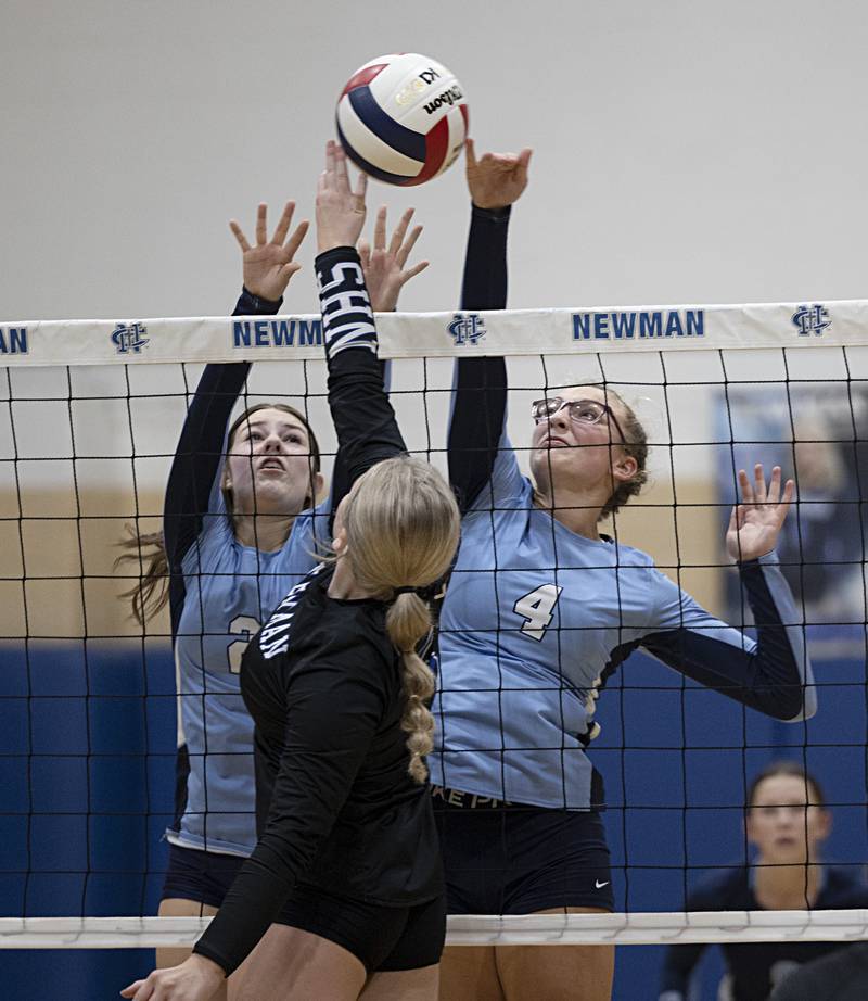 Bureau Valley’s Mattie Michelin (left) and Emma Stabler work against Newman’s Molly Olson Thursday, Sept. 28, 2023 at Newman.