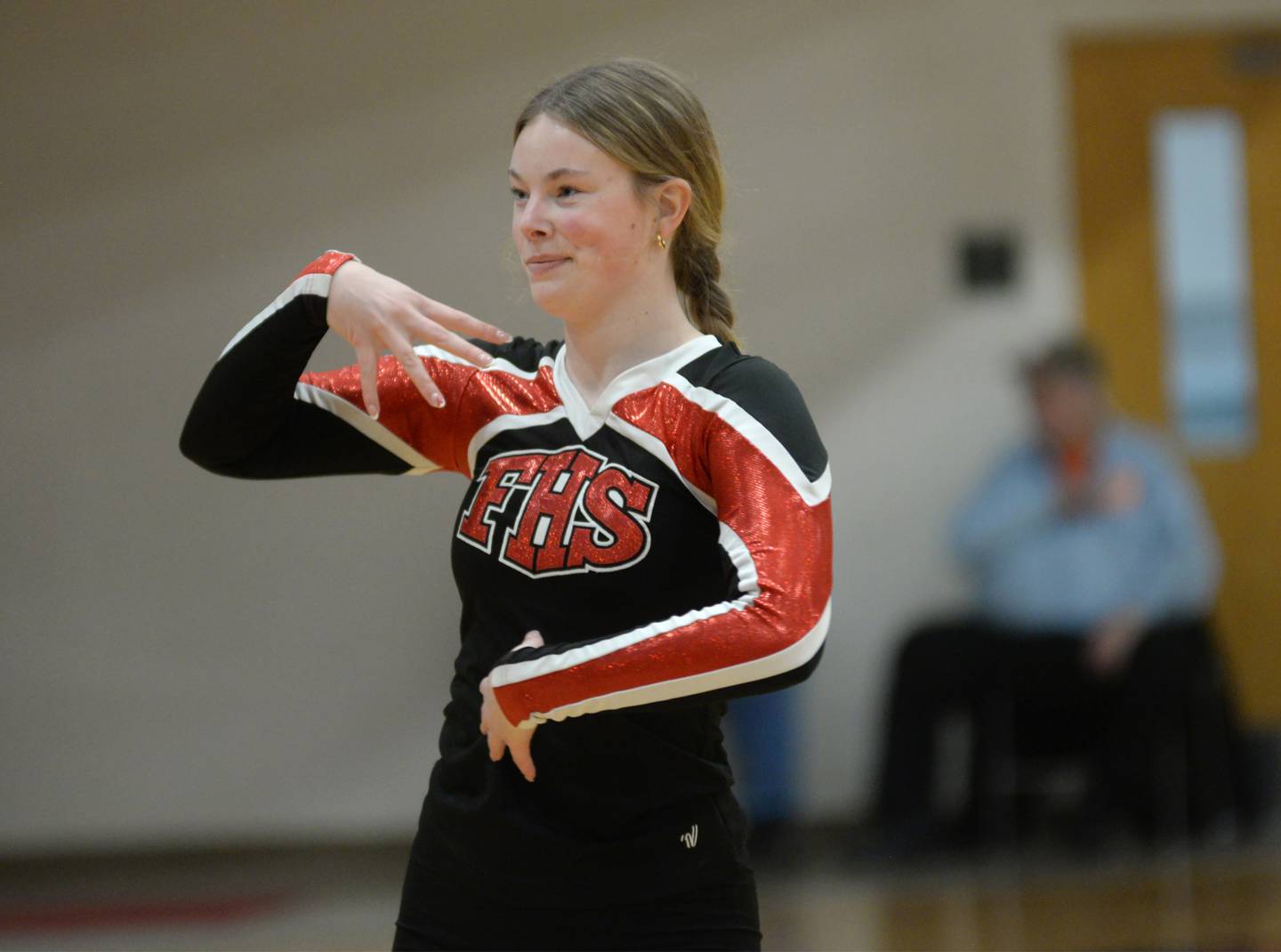 Grace Kaiser, a member of Forreston High School 's dance team, strikes a pose during the halftime performance at the boys varsity basketball game on Saturday, Jan. 4, 2025 at Forreston High School.