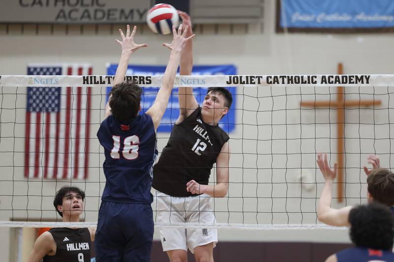 Joliet Catholic’s Austin Bernhard goes for the kill against St. Viator on Wednesday, April 24, 2024 in Joliet.