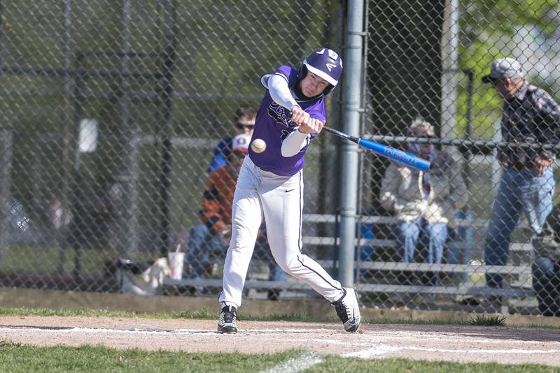 DIxon's Mason Randick swings and connects for a single against Oregon.