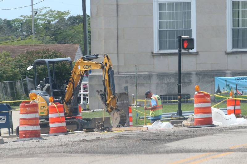 Crews work in the intersection of  West Street and U.S. 6 on Wednesday, July 31, 2024 in Peru. A long-term construction project is in full swing involving road patching, milling and resurfacing U.S. Route 6 from La Salle to Peru. In addition to roadwork, crews are rebuilding sidewalk ramps, drainage repairs, signal improvements and install raised reflectors. The 6.4 million project is expected to be fully completed by the end of summer 2025. Motorists are advised to use caution and be aware of traffic signals through the construction zones, which may cause increased wait times.