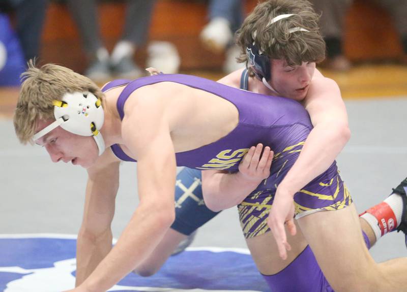 Mendota's Gavin Evans wrestels Marquette's Brysen Manly during the Class 1A Regional meet on Saturday, Jan. 31, 2026 at Princeton High School.