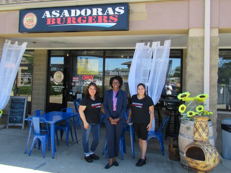Owners of Asadoras Argentina Burgers, Erica Caballos and Kristen Stika, with Congresswoman Lauren Underwood during her latinx small business tour Thursday, Aug. 11 2022, at 4542 IL-71 in Oswego. (from left to right: Caballos, Underwood, Stika)