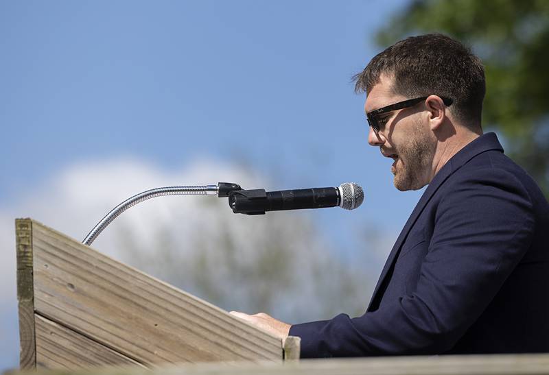 Dixon City Councilman Chris Bishop reads General Logan’s Orders making Memorial Day a holiday Monday, May 27, 2024 at Oakwood Cemetery in Dixon.