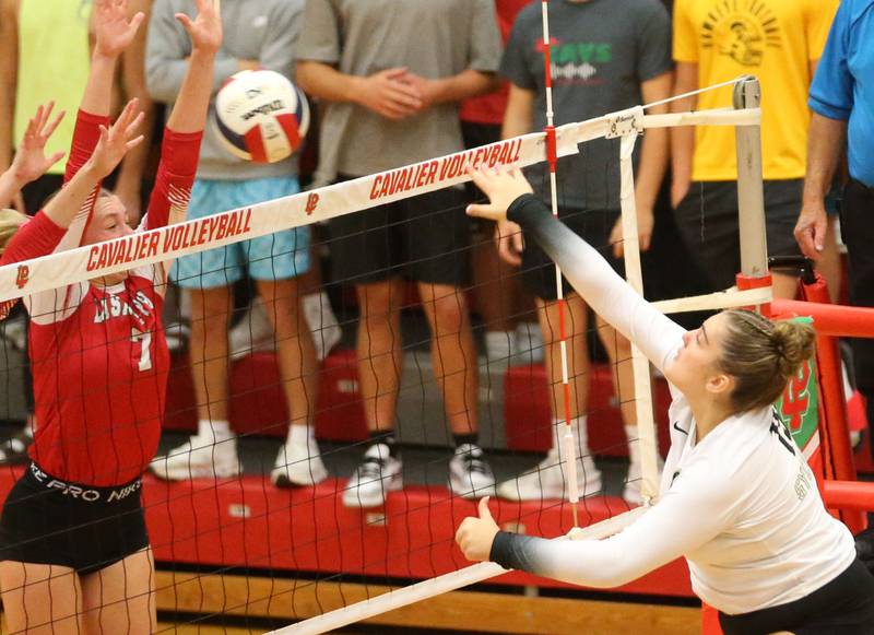 Sycamore's Sophia Martinez has her spike blocked by L-P's Aubrey Duttlinger on Tuesday, Sept. 23, 2025 in Sellett Gymnasium at L-P High School.