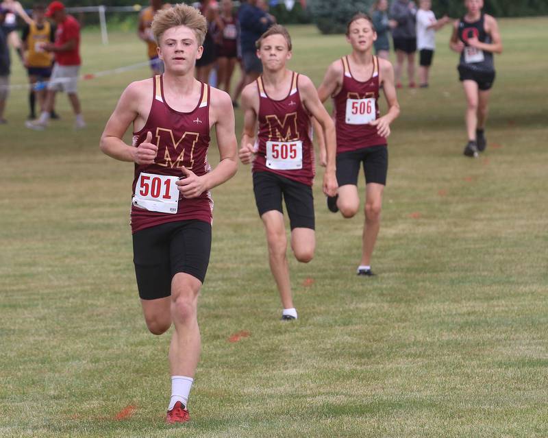 Morris runners (from left) KC Mack, Rusty Rogers and Skeeter Rogers compete during the Gary Coates Invitational cross country meet on Saturday, Sept. 13, 2025 at Zearing Park in Princeton .