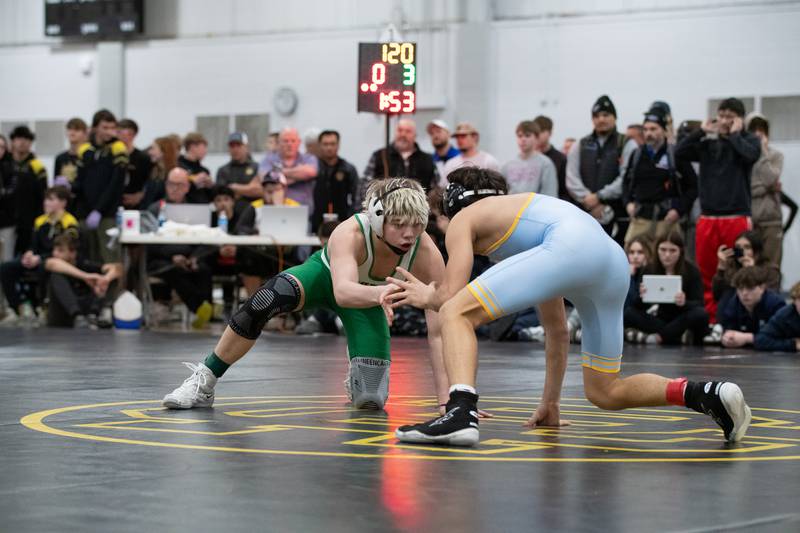 Seneca's Raiden Terry, left, and Ottawa's Wesley Janick wrestle in the 120-pound championship match during the Reed-Custer Comet Classic Wrestling Invite on Saturday, Jan 17.