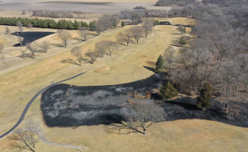 Crews burn off part of the green area for a controlled burn on Monday, March 2, 2026 at Deer Park Golf Club in Oglesby.