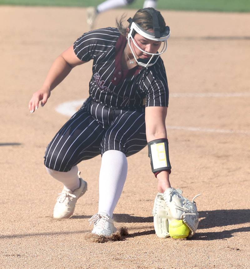 Morris' Ella Davis fields a bunt during their game against Sycamore Wednesday, May 10, 2023, at Sycamore High School.