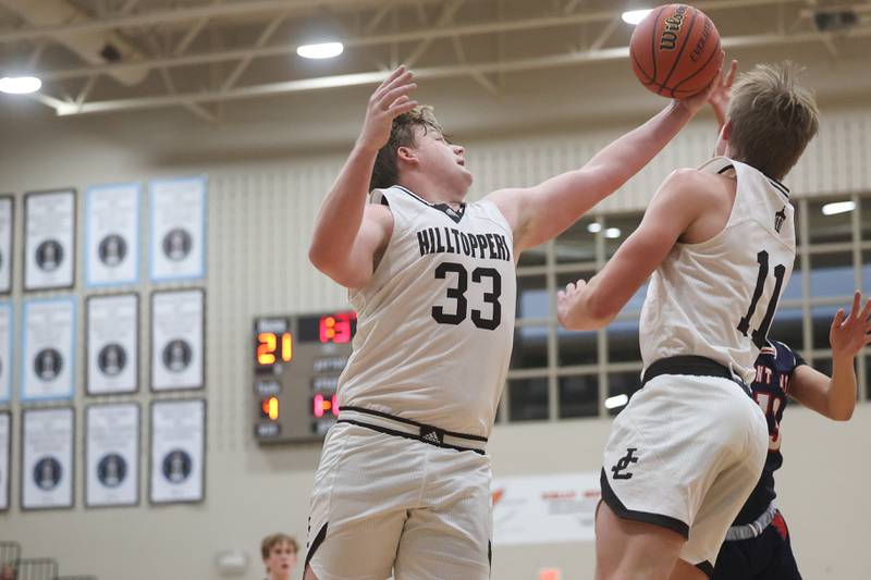 Joliet Catholic’s Anthony Birsa stretches for the rebound against St. Viator.