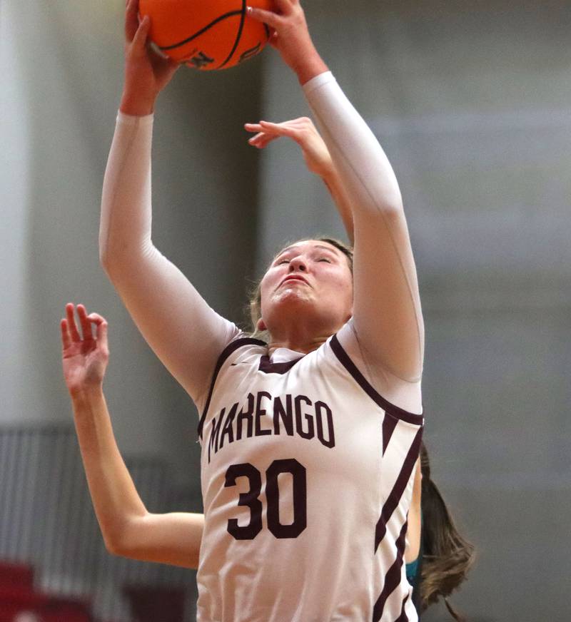 Marengo’s Macy Noe snags a rebound against  Woodstock North in varsity girls basketball on Tuesday, Dec. 2, 2025, at Marengo High School in Marengo.