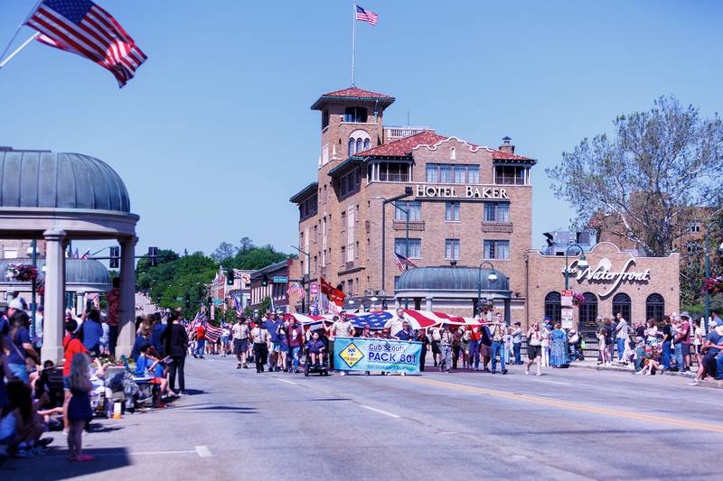 Cub Scout Pack 801 carries a big flag at the Memorial Day parade on Monday, May25,2026 in St. Charles.