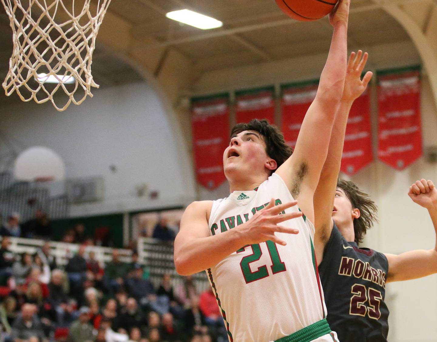 L-P's Josh Senica (21) looks to dunk the ball over Morris' Brett Bounds in Sellett Gymnasium on Friday, Jan. 13, 2023, at L-P High School.