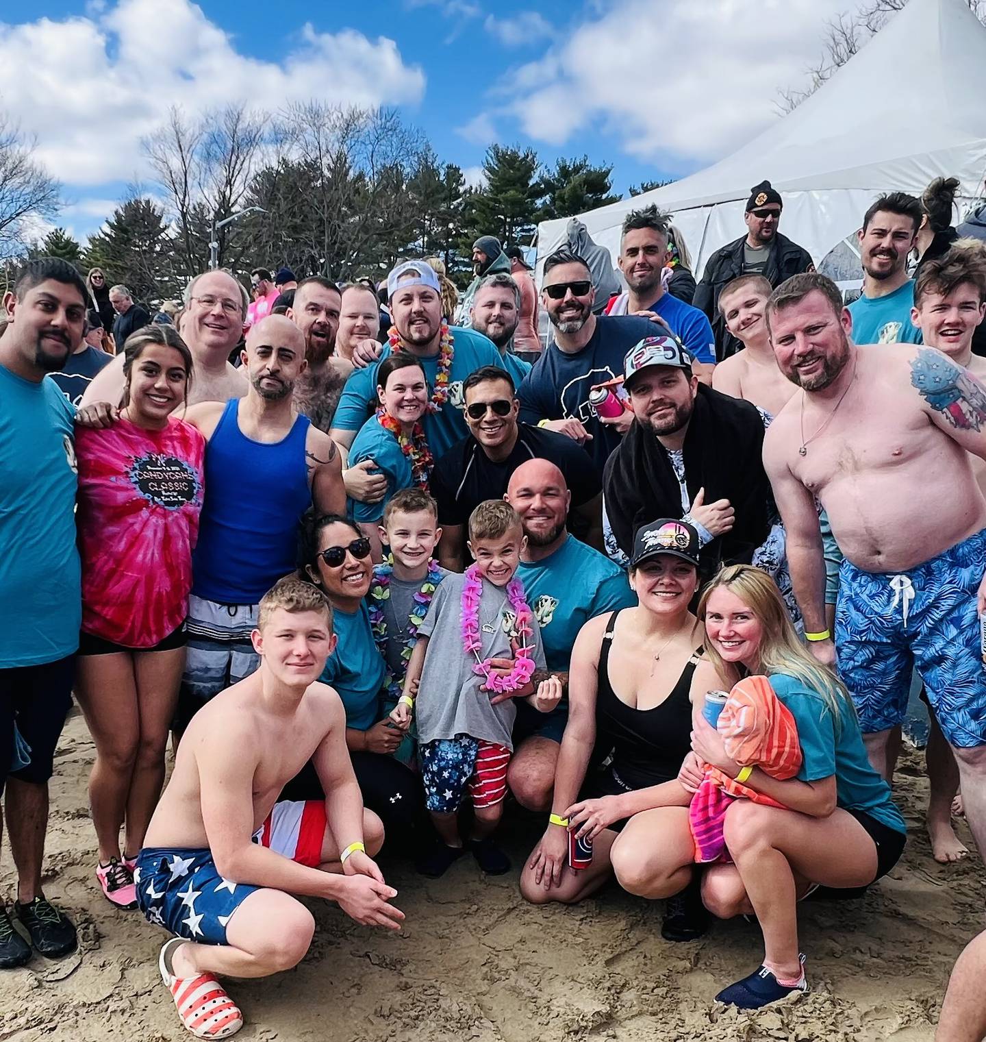 Will County Sheriffs deputies and husband and wife Victoria and Mike Sims, front center, pose with their 7-year-old twin boys Harris and Berkley and the Will County Sheriffs’ group at the annual Law Enforcement Torch Run Polar Plunge for the Special Olympics on Saturday, March 9th in Braidwood.