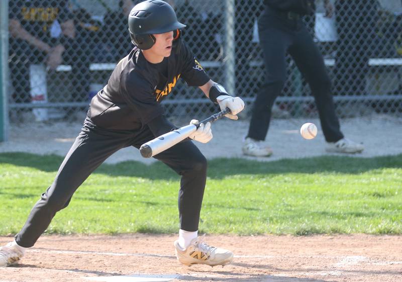 Putnam County's AJ Furrar bunts the ball against St. Bede on Thursday, May 8, 2025 at St. Bede Academy.