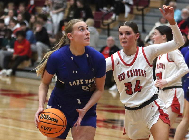 Huntley’s Ava McFadden, right, guards Lake Zurich’s Leah Gilbertson in IHSA Class 4A Sectional girls basketball action on Tuesday, Feb. 25, 2025, at Huntley High School in Huntley.