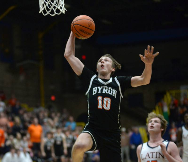 Byron's Ryan Tucker (10) jumps to dunk the ball in first quarter action  at the 2A Supersectional in Sterling on Monday, March 4, 2024. The Tigers beat Chicago Latin 85-71 to advance to the state finals this week in Champaign.