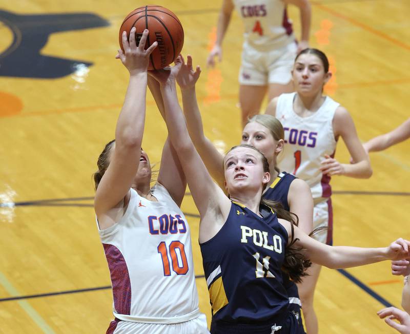 Genoa-Kingston's Elizabeth Davis and Polo's Courtney Grobe go after a rebound during their game Monday, Jan. 29, 2024, at Genoa-Kingston High School.