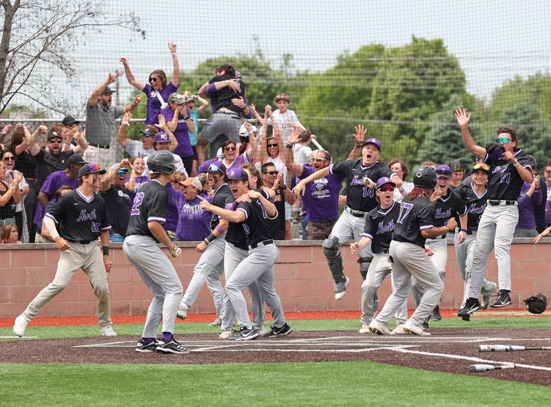 Downers Grove North celebrates Jimmy Janicki's walk-off homerun in the bottom of the 7th during the IHSA Class 4A baseball regional final between Downers Grove North and Hinsdale Central at Bolingbrook High School on Saturday, May 27, 2023.