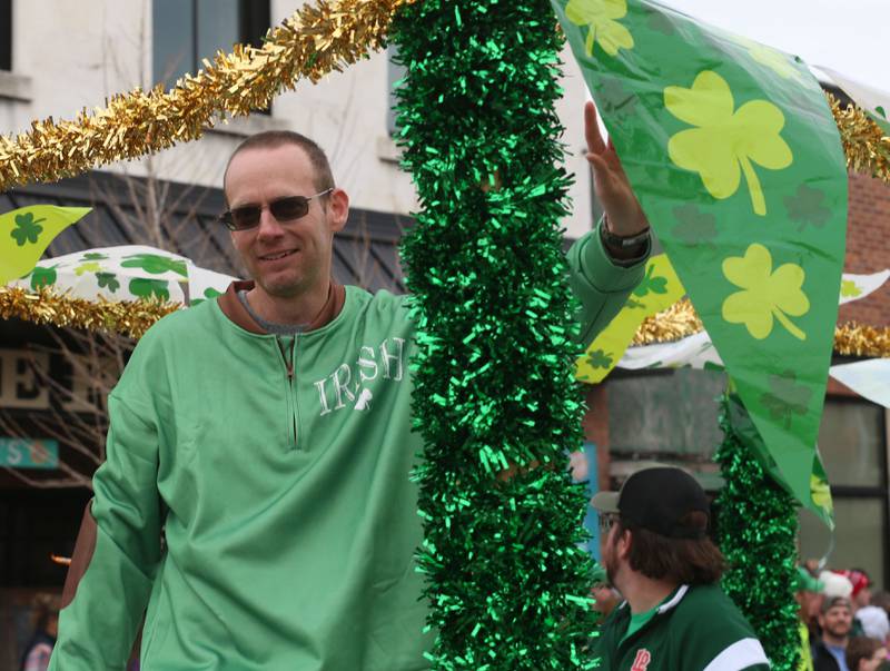Utica mayor Dave Stewart waves to the crowd during the St. Patrick's Day parade on Saturday, March 15, 2025 downtown Utica.