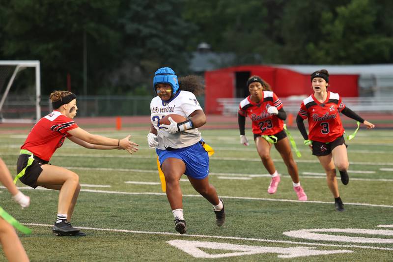 Joliet Central's Georgianna Majerus runs the ball as Bradley-Bourbonnais defenders close in during the Boilermakers' 60-7 victory over Joliet Central in the season opener on Aug. 25, 2025.